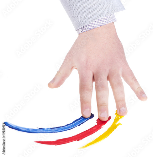 Photo: hand that colors on a white background hand that colors on a white background