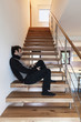 interior, man sitting on the stairs