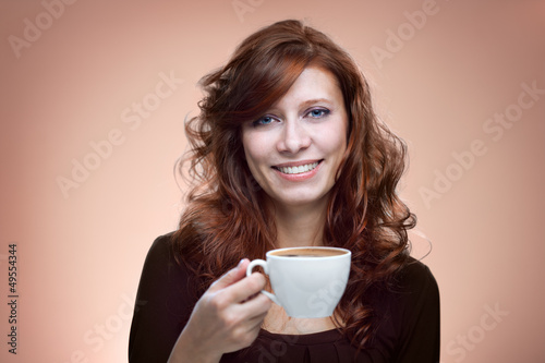 Photo: woman with an aromatic coffee woman with an aromatic coffee