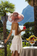 portrait of beautiful woman on the terrace of prestigious hotel