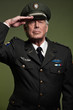 US military general wearing cap. Salutation. Studio portrait.