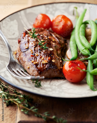 Photo: Rustic steak with vegetables and herbs Rustic steak with vegetables and herbs