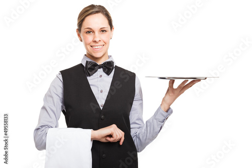 Photo: Female waiter holding an empty dish Female waiter holding an empty dish