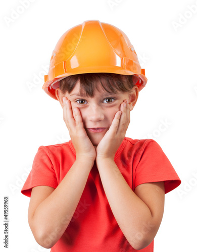 Photo: Little girl in a protective helmet Little girl in a protective helmet