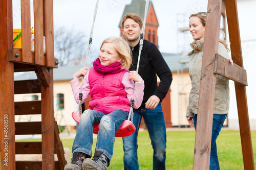 Photo: Family on the playground Family on the playground