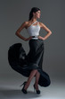 girl dances in a black silk skirt