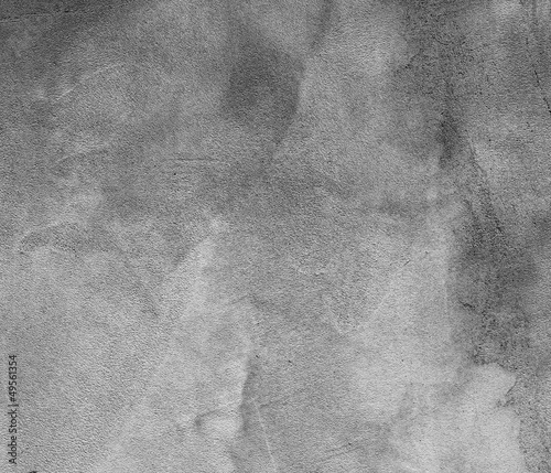 Photo: Gloomy concrete wall. Fragment of a old concrete wall. Gloomy concrete wall. Fragment of a old concrete wall.