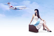 Young woman on the vintage baggage wait on the flying