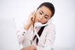Woman talking by phones simultaneously