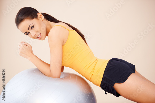 Photo: Young happy woman with fitness ball Young happy woman with fitness ball