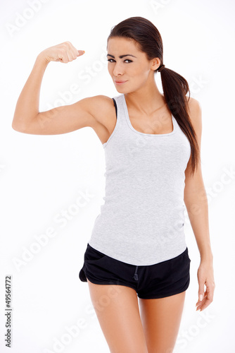 Photo: Woman showing her muscle Woman showing her muscle