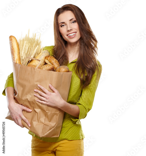 Photo: Smiling woman holding a grocery bag Smiling woman holding a grocery bag