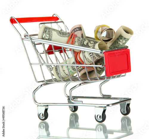 Photo: shopping trolley with dollars, isolated on white shopping trolley with dollars, isolated on white