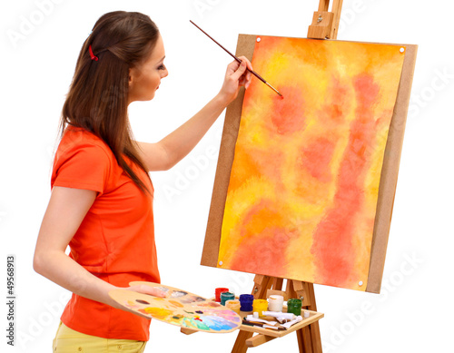 Photo: beautiful young woman painter at work, isolated on white beautiful young woman painter at work, isolated on white