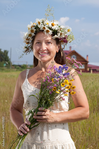 Photo: woman in camomile chaplet woman in camomile chaplet