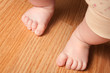 Young girl taking her first steps