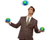 Business man juggling with Earth