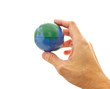 Photo: hand holding a global model toy hand holding a global model toy