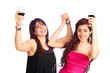 Photo: Two happy cheering women raising wine glass Two happy cheering women raising wine glass