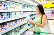 Woman buys yogurt