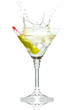 Olive splashing on martini glass isolated on white