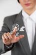 Photo: Business woman pointing her fingers on virtual web interface ico Business woman pointing her fingers on virtual web interface ico