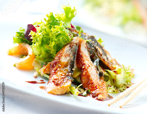 Photo: Salad With Smoked Eel with Unagi Sauce. Japanese Food Salad With Smoked Eel with Unagi Sauce. Japanese Food