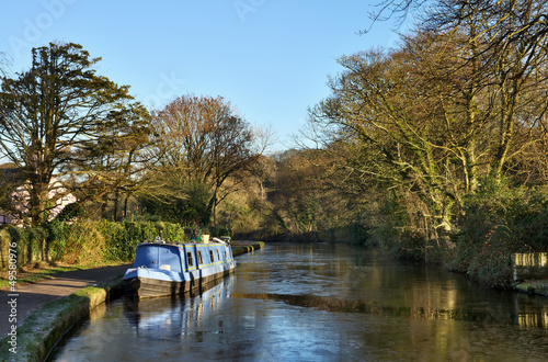Photo: Blue barge moored on the Lancaster Canal Blue barge moored on the Lancaster Canal