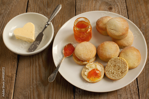 Photo: Home-baked scones tea with jam and butter Home-baked scones tea with jam and butter