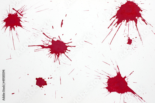 Photo: Red blood splash on white paper Red blood splash on white paper