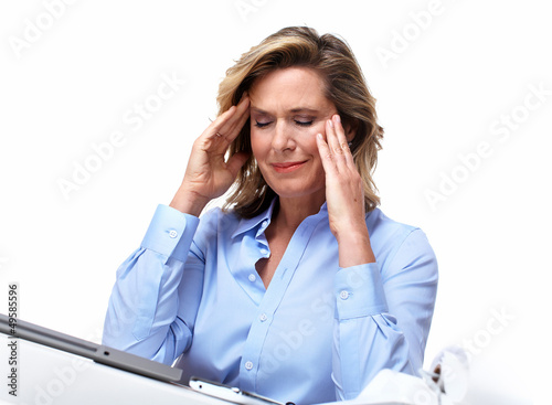 Photo: Business woman having a headache. Business woman having a headache.