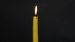Burning-down yellow candle. Time lapse 1