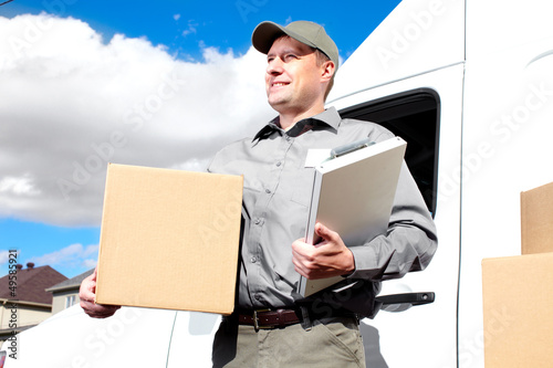 Photo: Delivery postal service man. Delivery postal service man.
