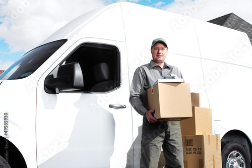 Photo: Delivery postal service man. Delivery postal service man.
