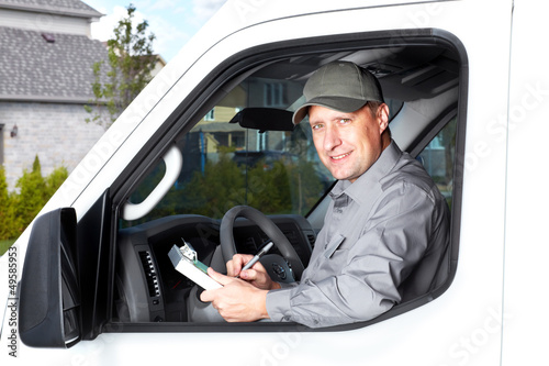 Photo: Handsome truck driver. Handsome truck driver.