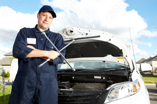 Photo: Professional auto mechanic. Professional auto mechanic.