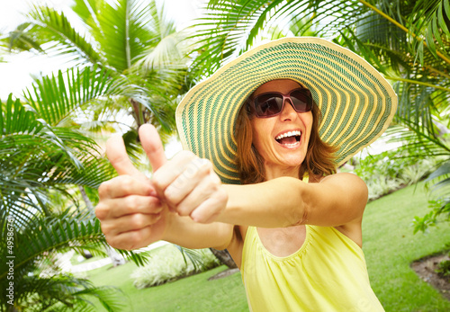 Photo: Woman in the tropical garden. Woman in the tropical garden.