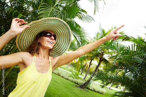 Photo: Woman in the tropical garden. Woman in the tropical garden.