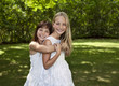 Two Young Girls in White Dresses