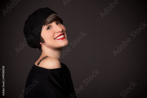 Photo: Smiling girl with french style outfit and copy space Smiling girl with french style outfit and copy space
