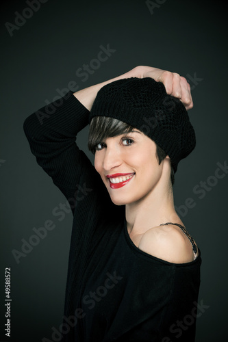 Photo: Smiling girl with french style outfit and copy space Smiling girl with french style outfit and copy space
