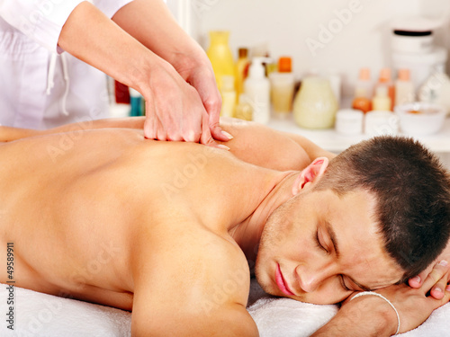 Photo: Man getting massage in spa. Man getting massage in spa.