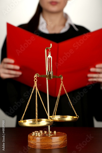 Photo: Judge read verdict on grey background Judge read verdict on grey background