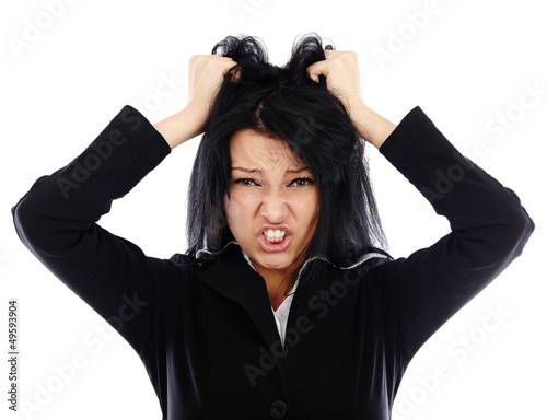 Photo: Portrait of an angry businesswoman pulling her hair Portrait of an angry businesswoman pulling her hair