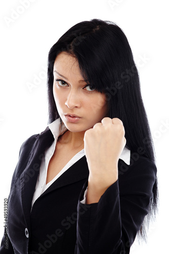Photo: Threatening businesswoman showing her fist Threatening businesswoman showing her fist