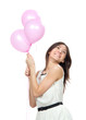 happy girl with balloons as a present for birthday party smilin