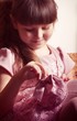 Beautiful little girl in pink dress in vintage style