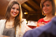 Friends having a round of drinks