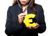 Photo: Closeup of woman examining euro Closeup of woman examining euro