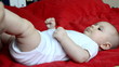 Young mother puts baby socks